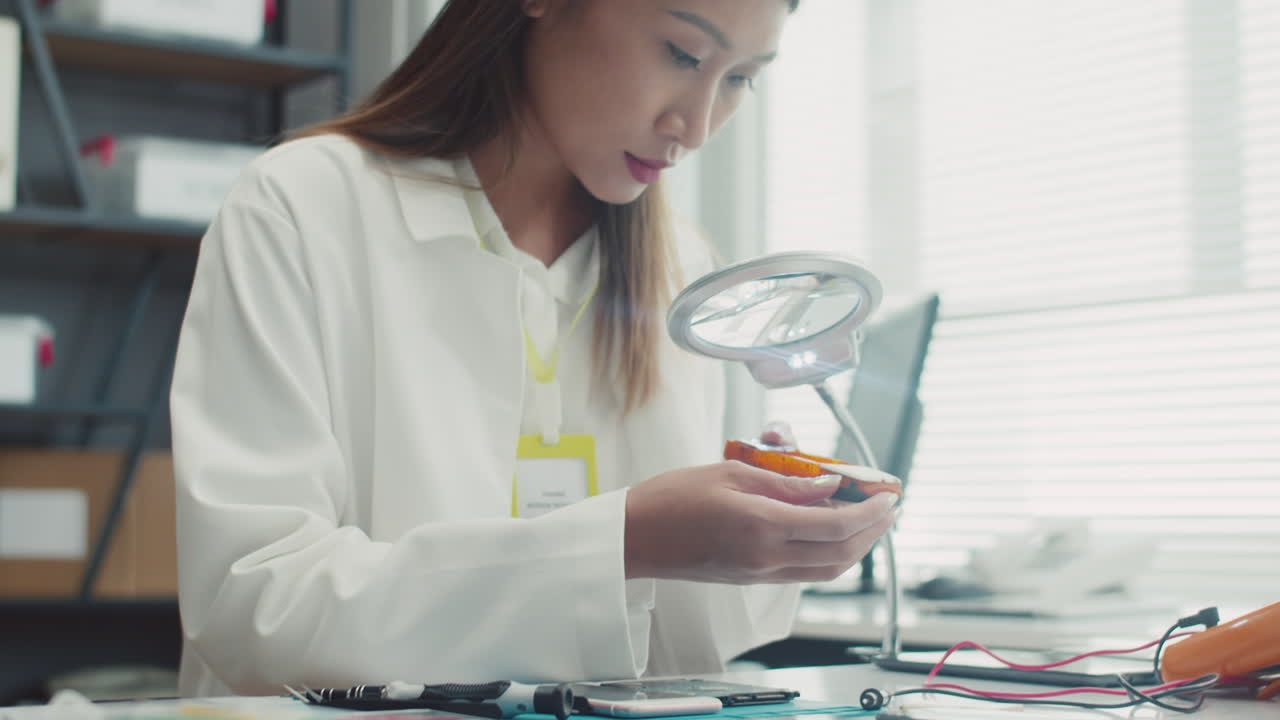 Mobile Phone Repair Specialist Smiling at Camera