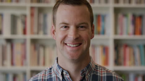 portrait-successful-young-entrepreneur-man-smiling-enjoying-professional-business-success-confident-male-in-library-bookstore-background-positive-education