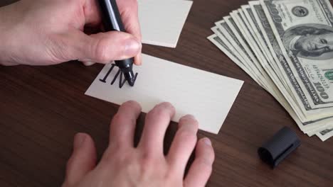 writing the word "investment" on a piece of paper