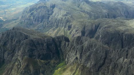 Aerial-Drone-shot-of-mountain-ranges-from-a-plane