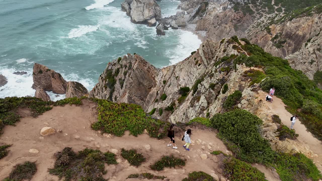 Coastal Cliffside View with People Hiking