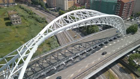 drone flies above modern bridge in rome, italy