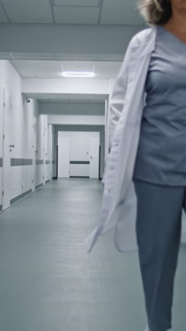 doctor walking in a modern hospital corridor