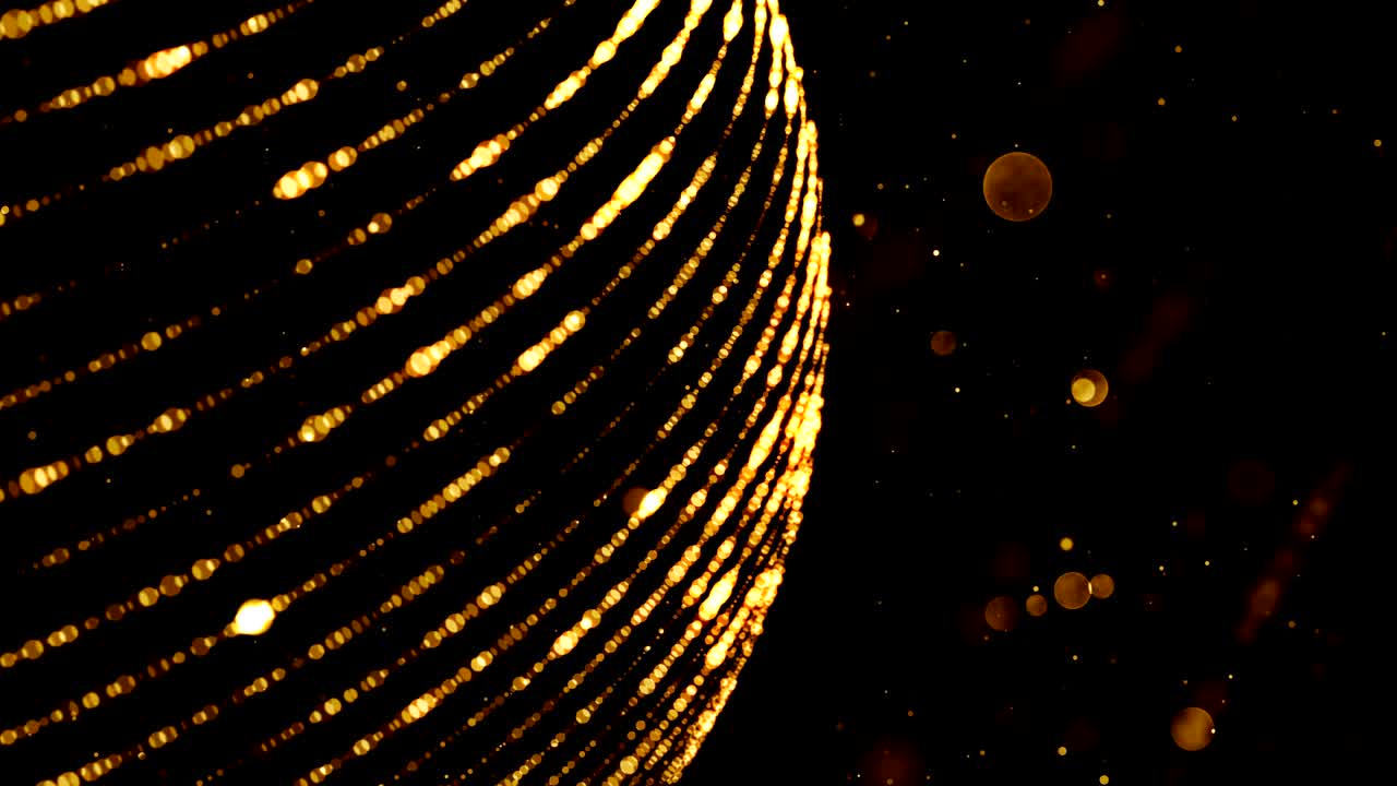 금색 구와 반이는 입자들과 함께 추상적인 배경.