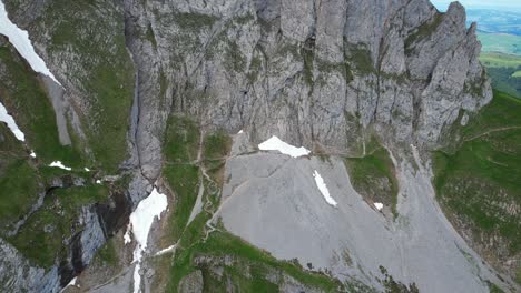 4k drone aerial shot of rugged landscape at shäfler ridge in appenzell region of switzerland