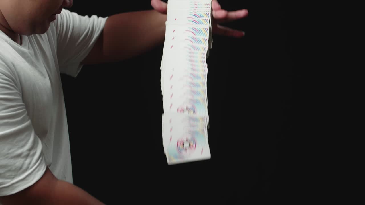 Magician Starts Showing His Trick With Cards, Cards Cascading Down. Slow Motion