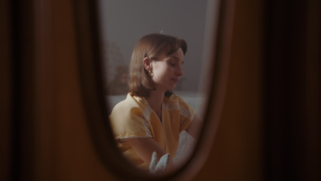 A girl playing with dolls in her room