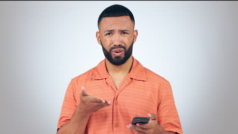 phone, stress and face of man in studio with wtf