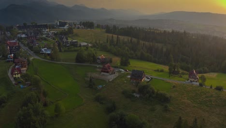 stunning villas with evergreen mountain pasture during sunset in cyrhla, podhale region, poland