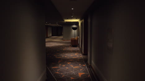 walking in hotel hallway with dim light