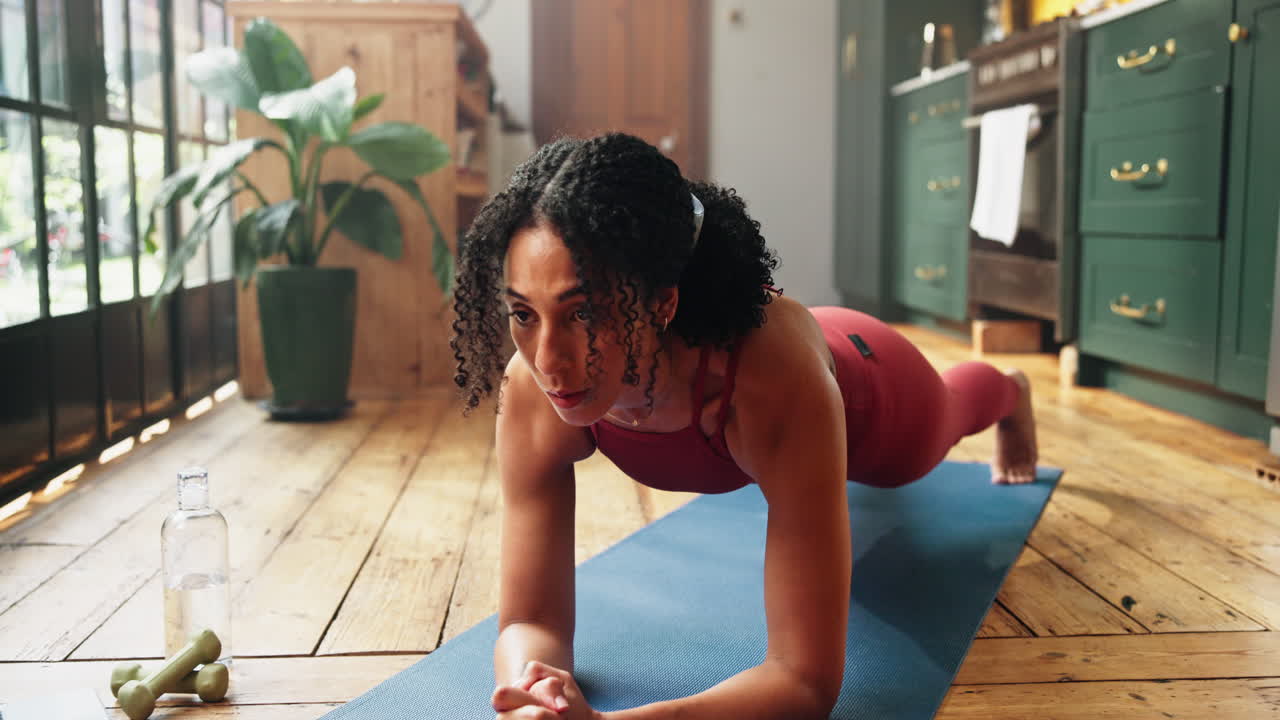 Young Woman Doing Plank Exercise on Yoga Mat at Home