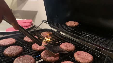 flipping-burgers-on-grill-4k