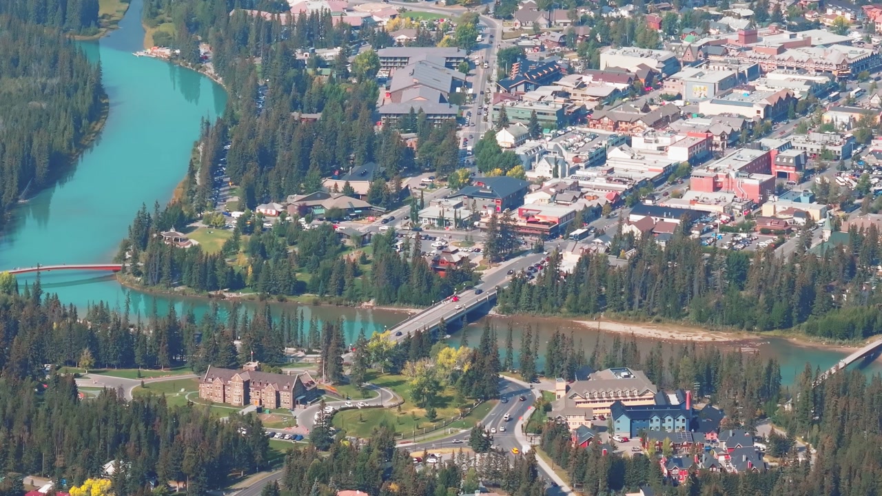 Aerial Revealing shot, Town of Banff, Morning shot. Banff National Park, Alberta, Canada.