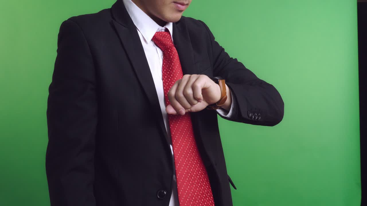 Businessman Checking Wristwatch