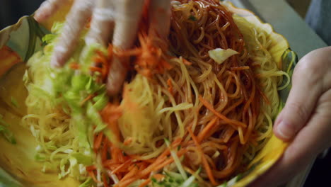 Close-up-of-mixing-Korean-chili-paste-in-a-large-bowl-to-create-Korean-Spicy-Chew-Noodles