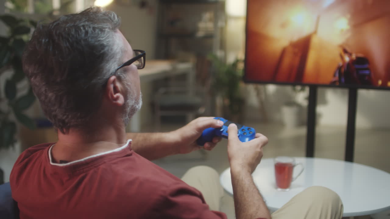 Man playing a video game in a living room