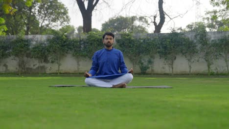 young indian man doing meditation