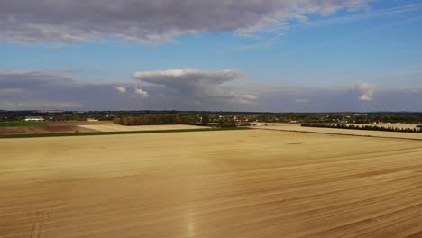 aerial view of golden fields with brown mold close to sejerøbugten in odsherred