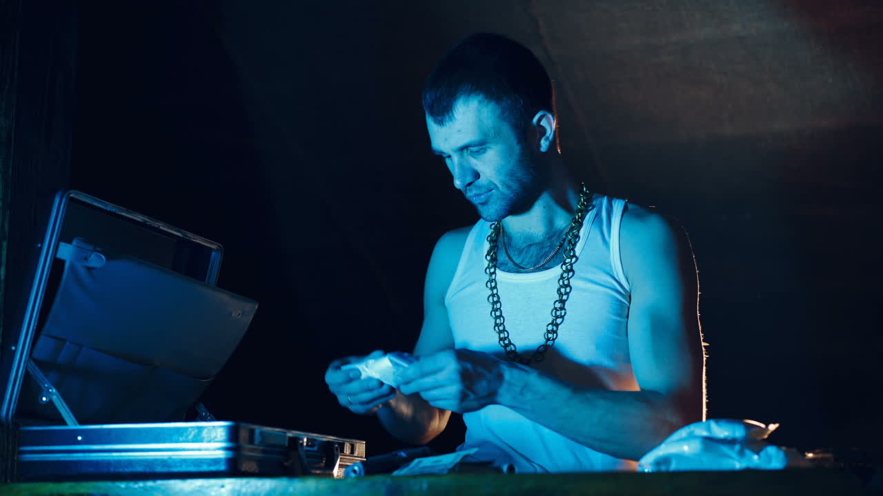 Brutal Drug Dealer Takes Packed Drug Brick out of the Suitcase and Cuts it with a Knife to try a Sample.