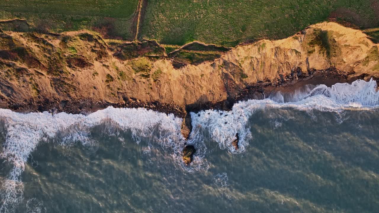 Coastal erosion on fragile sea cliffs at Copper Coast Waterford Ireland result of Atlantic Winter storm