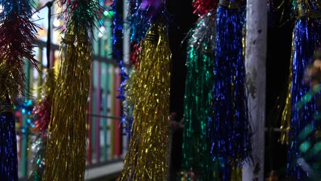 carnival with ferris wheel, bright colourful lights, car carousel at night closeup