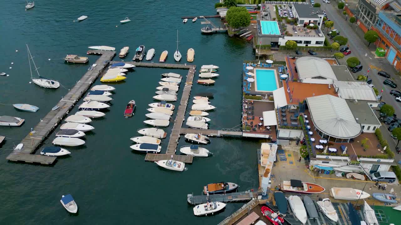 4K Aerial Drone Video of Boat Entering the Marina on Beautiful Lake Como, Italy in the Summer