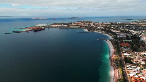 aerial view of esperance city esplanade and the harbour in the background with a tanker getting refueled on an overcast day, western australia