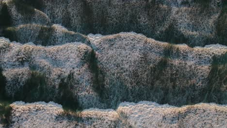 white surf and waves from overhead, 4k drone shot