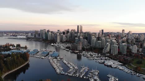 rare golden hour aerial right sweep of downtown skyline facing coal harbour