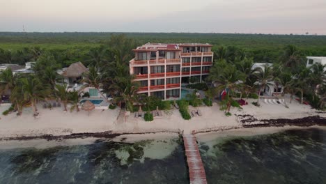 Scenic-aerial-view-of-the-Alea-Hotel-at-the-beach-front-in-Tulum,-Mexico