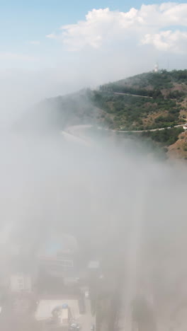 misty mountain landscape with cityscapes