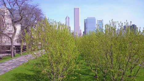 a rising shot in downtown chicago reveals the city skyline