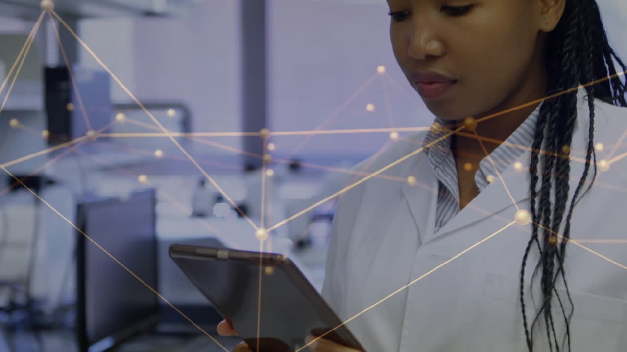 Scientist in lab tapping tablet and animating network overlay across hands while checking data