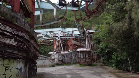 Drone-dolly-flight-forward-inside-the-ruins-of-the-old-cable-car-station-El-Liron,-located-in-San-Antonio-de-Galipan,-Venezuela