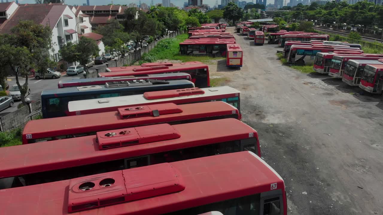 Aerial view of derelict buses in quiet graveyard setting in Kuala Lumpur Malaysia