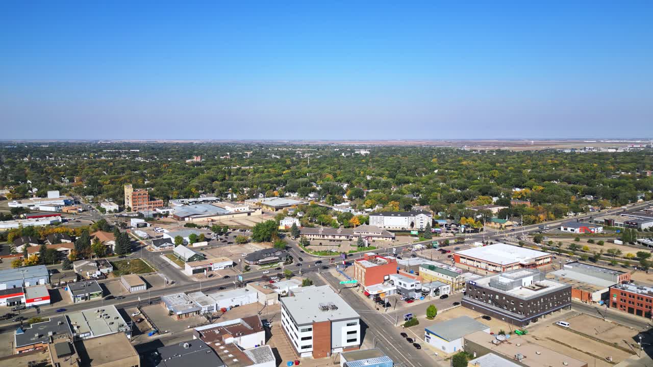 Aerial view captures Saskatoon with abundant parkland and downtown beyond