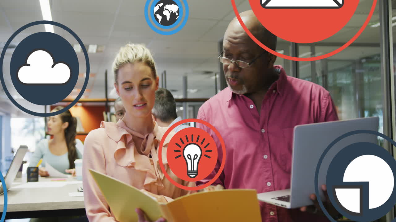 Animation of digital icons over diverse business people in office