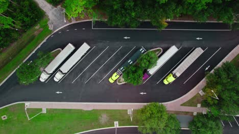 top down cinematic aerial semi truck rest area in florida with highway, transportation concept