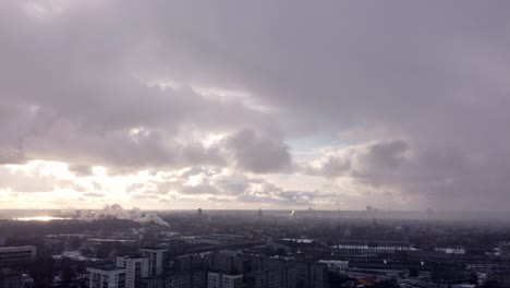 post apocalyptic city scene on an overcast winter day, aerial tilt up over buildings