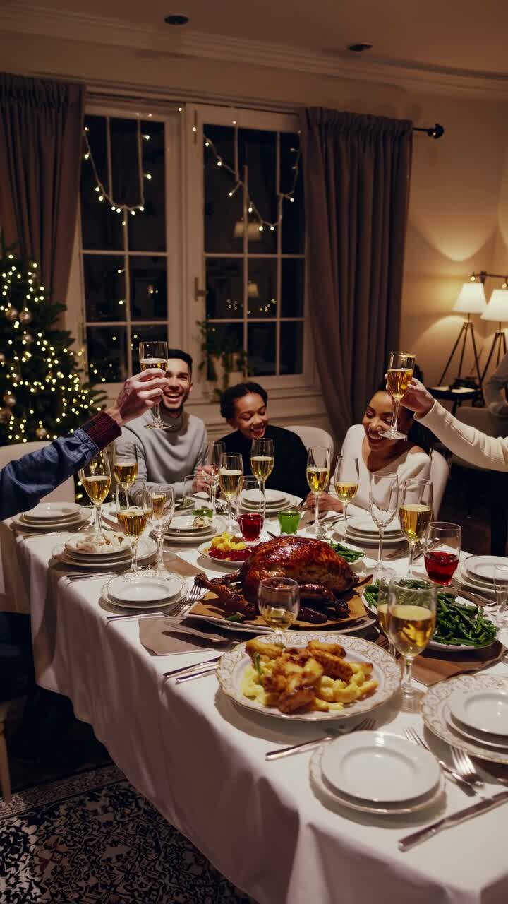 Festive dinner scene captured from a high angle, showcasing a joyful group around a holiday table