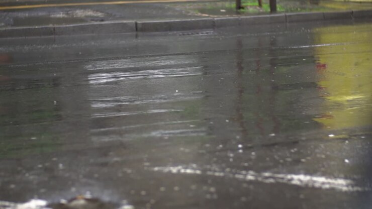 Car Tyres Driving Over Deep Pond And Splashing Water In Slow Motion