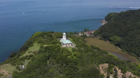 lighthouse on tomogashima island, aerial orbit shot, wakayama japan