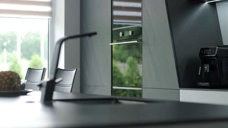 water dripping from faucet tap at kitchen. closeup