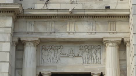 detailed view of a marble building with stone carvings