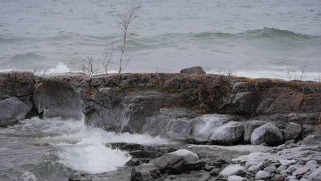 Slow-motion-waves-hitting-rocky-shoreline