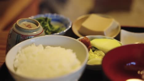 japanese traditional meal, rice, vegetables, miso soup and pickles in washoku