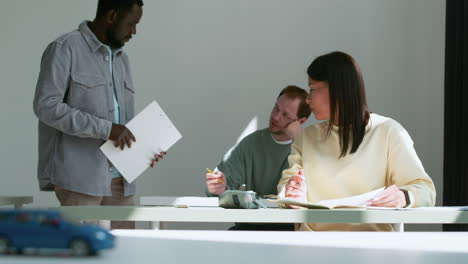 teacher and students in driving school