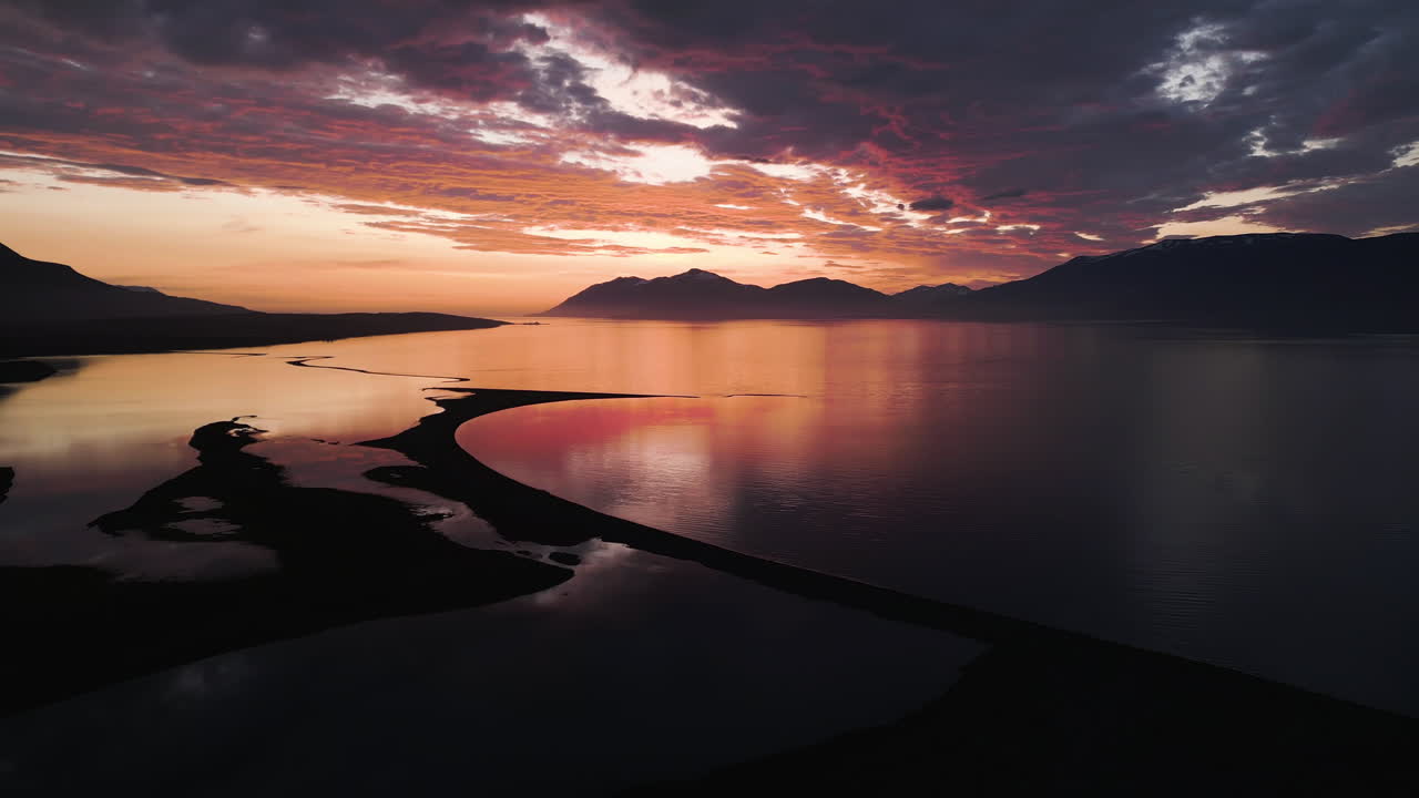 Stunning Icelandic coast at golden hour with vibrant sky reflections