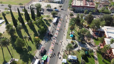 drone view of an outdoor event with people on bikes.