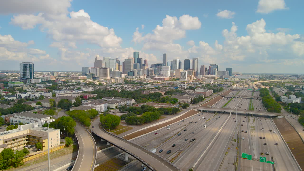 Aerial Establishing, Downtown Houston Texas, skyline Traffic Skyscraper buildings, famous American city, Texas 288 freeway. Drone shoot the Texas 288 overlooking Houston Downtown